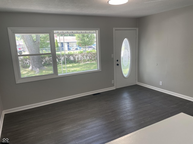 3119 N Fuller Dr, Indianapolis, IN 46224 - foyer with dark wood-style floors and baseboards