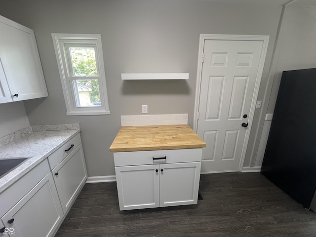 3119 N Fuller Dr, Indianapolis, IN 46224 - kitchen with wood counters, dark wood-style floors, and white cabinets