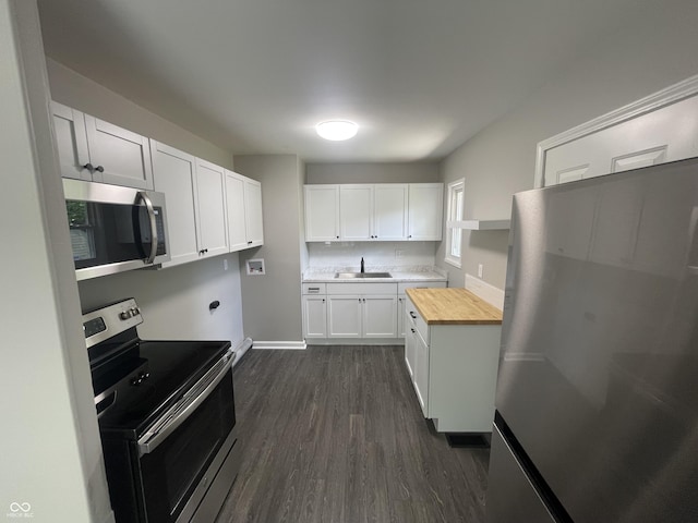 3119 N Fuller Dr, Indianapolis, IN 46224 - kitchen featuring stainless steel appliances, wooden counters, dark wood-type flooring, and white cabinets