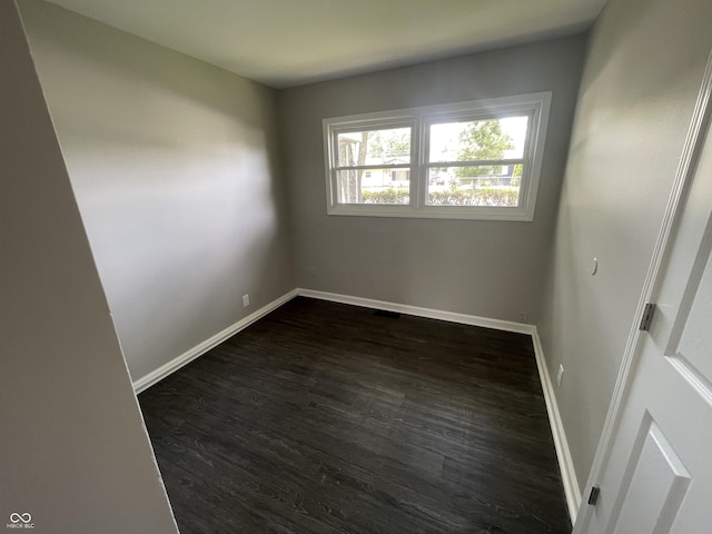 3119 N Fuller Dr, Indianapolis, IN 46224 - empty room with dark wood-style floors and baseboards