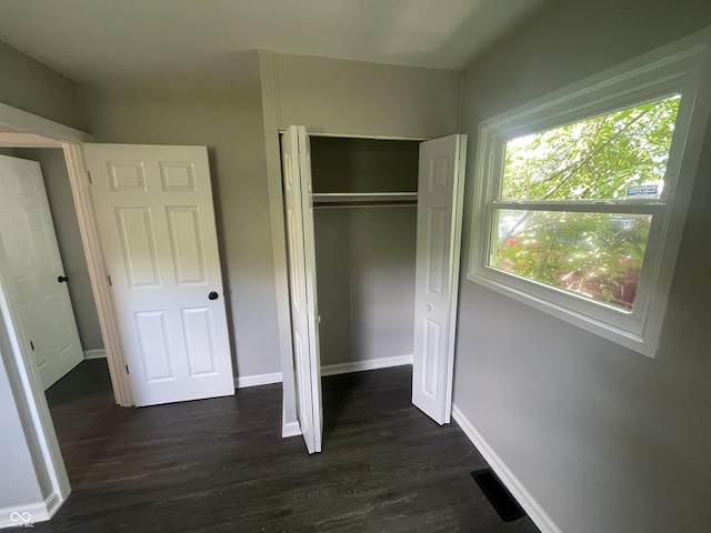 3119 N Fuller Dr, Indianapolis, IN 46224 - unfurnished bedroom featuring dark wood-style flooring and a closet