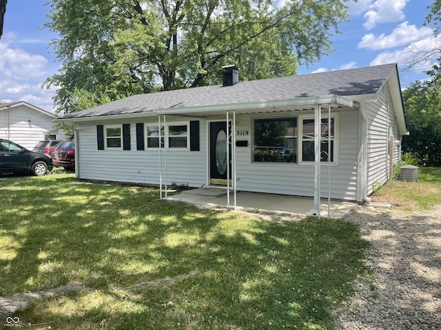 3119 N Fuller Dr, Indianapolis, IN 46224 - view of front of property with a front yard, a chimney, and roof with shingles
