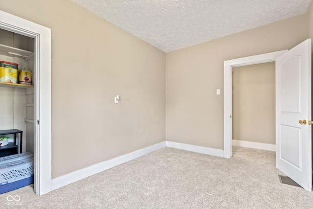 1418 S 7th St, Terre Haute, IN 47802 - unfurnished bedroom featuring carpet flooring and a textured ceiling