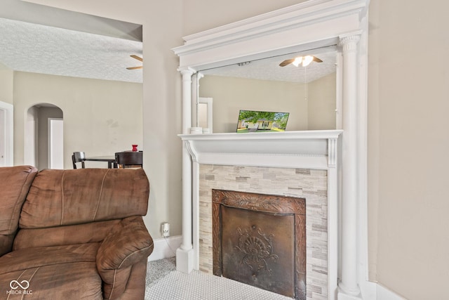 1418 S 7th St, Terre Haute, IN 47802 - living area with ceiling fan, arched walkways, a textured ceiling, and a tile fireplace