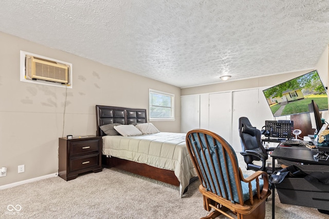 1418 S 7th St, Terre Haute, IN 47802 - bedroom featuring a desk, a textured ceiling, light carpet, and an AC wall unit