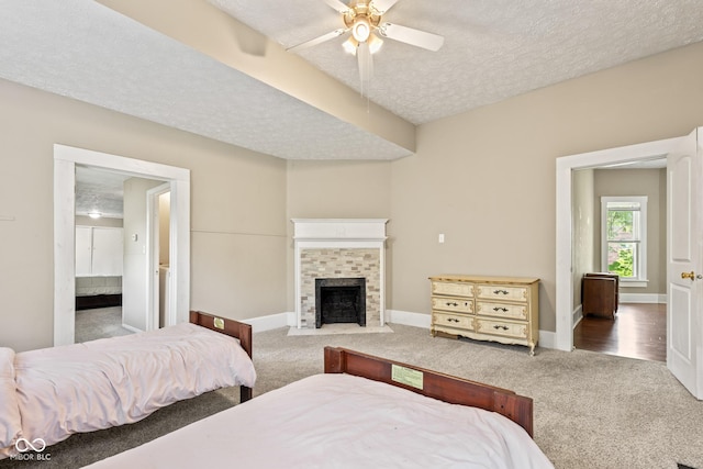 1418 S 7th St, Terre Haute, IN 47802 - bedroom featuring carpet, a textured ceiling, a fireplace, ceiling fan, and ensuite bath