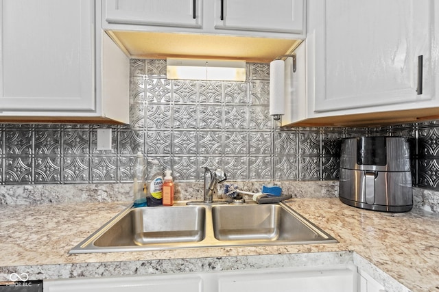 1418 S 7th St, Terre Haute, IN 47802 - kitchen featuring light countertops, white cabinetry, and tasteful backsplash