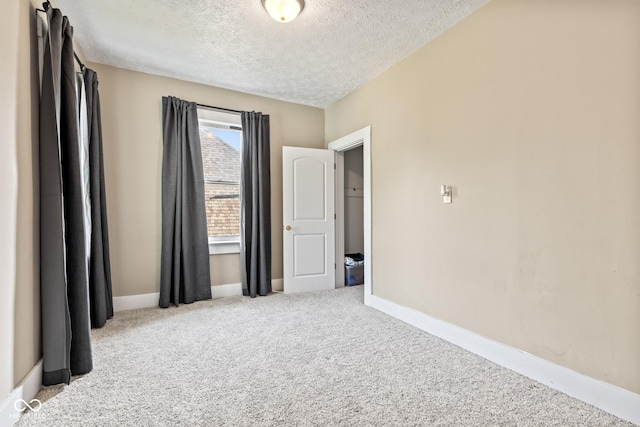 1418 S 7th St, Terre Haute, IN 47802 - carpeted spare room featuring a textured ceiling and baseboards