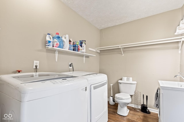 1418 S 7th St, Terre Haute, IN 47802 - laundry area with independent washer and dryer, wood finished floors, and a textured ceiling