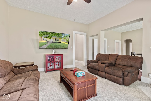 1418 S 7th St, Terre Haute, IN 47802 - carpeted living room with arched walkways, a textured ceiling, and a ceiling fan
