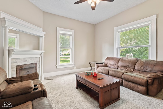 1418 S 7th St, Terre Haute, IN 47802 - carpeted living room featuring a ceiling fan and a stone fireplace