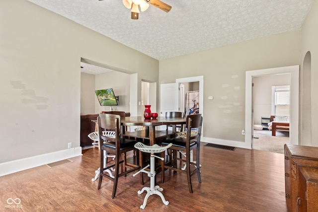 1418 S 7th St, Terre Haute, IN 47802 - dining space with wood finished floors, a ceiling fan, and a textured ceiling