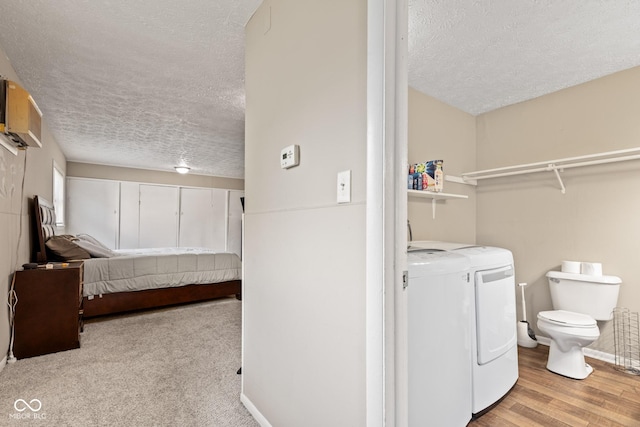 1418 S 7th St, Terre Haute, IN 47802 - washroom with washing machine and dryer, a textured ceiling, and wood finished floors