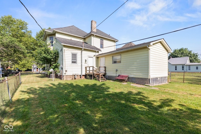 1418 S 7th St, Terre Haute, IN 47802 - back of property with a fenced backyard and a chimney