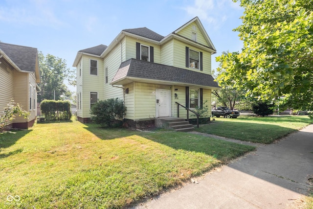 1418 S 7th St, Terre Haute, IN 47802 - traditional home featuring roof with shingles and a front lawn