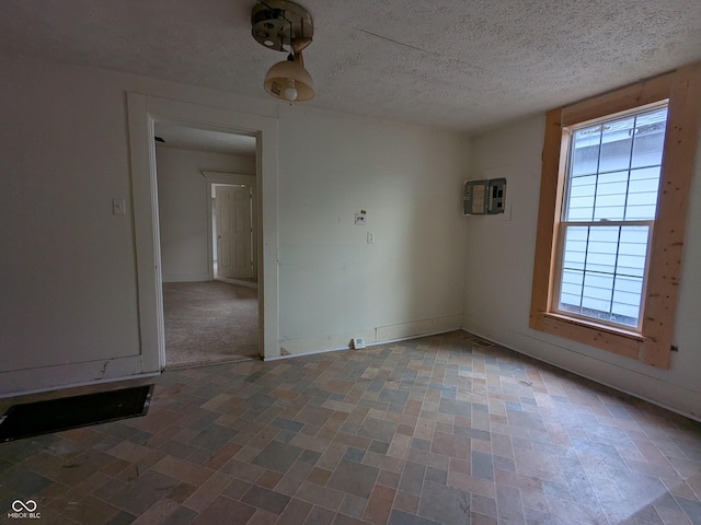 347 E Mechanic St E, Shelbyville, IN 46176 - unfurnished room with a textured ceiling and an AC wall unit