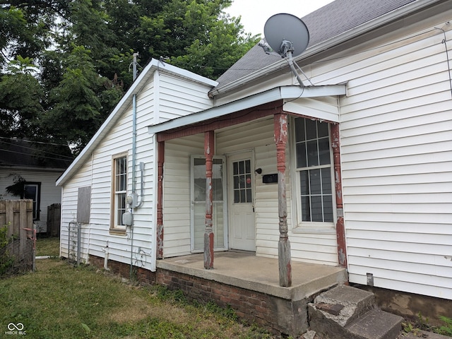 347 E Mechanic St E, Shelbyville, IN 46176 - view of exterior entry with a porch and roof with shingles