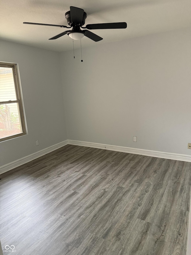 4024 Zinfandel Way, Indianapolis, IN 46254 - empty room with dark wood-style floors and ceiling fan