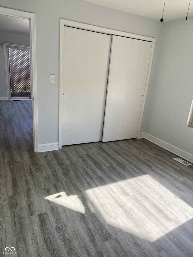 4024 Zinfandel Way, Indianapolis, IN 46254 - unfurnished bedroom featuring wood finished floors and a closet