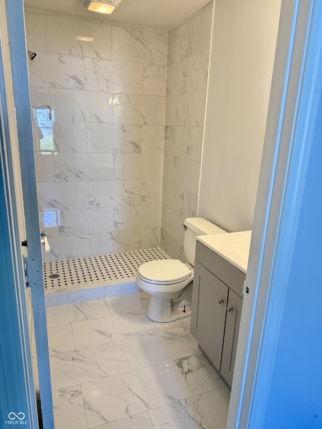 4024 Zinfandel Way, Indianapolis, IN 46254 - bathroom with vanity, marble finish floors, and a stall shower