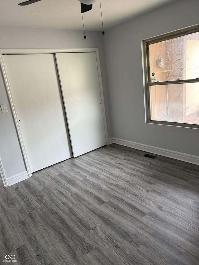 4024 Zinfandel Way, Indianapolis, IN 46254 - unfurnished bedroom with wood finished floors and a closet