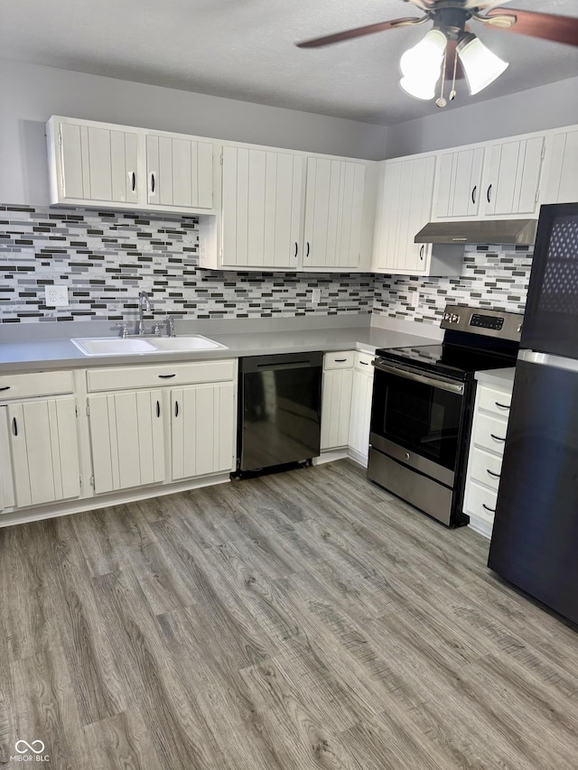4024 Zinfandel Way, Indianapolis, IN 46254 - kitchen featuring dishwasher, electric range, freestanding refrigerator, under cabinet range hood, and a ceiling fan