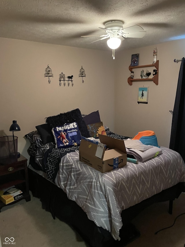 6191 Wildcat Dr, Indianapolis, IN 46203 - bedroom with a textured ceiling, carpet floors, and a ceiling fan