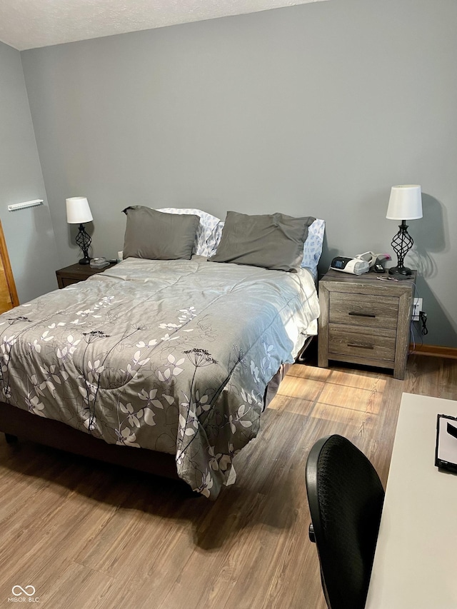 6191 Wildcat Dr, Indianapolis, IN 46203 - bedroom featuring wood finished floors and baseboards