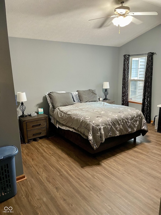 6191 Wildcat Dr, Indianapolis, IN 46203 - bedroom with wood finished floors, a ceiling fan, and lofted ceiling