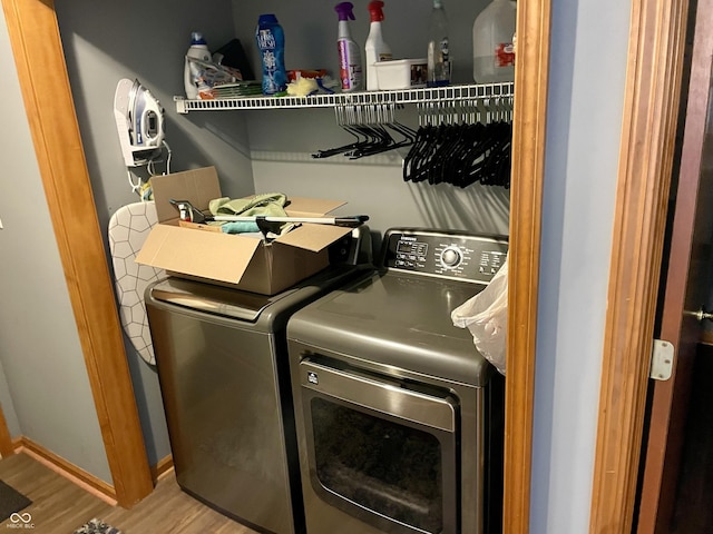 6191 Wildcat Dr, Indianapolis, IN 46203 - laundry area featuring independent washer and dryer and wood finished floors