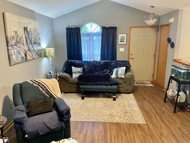 6191 Wildcat Dr, Indianapolis, IN 46203 - living room featuring wood finished floors and vaulted ceiling