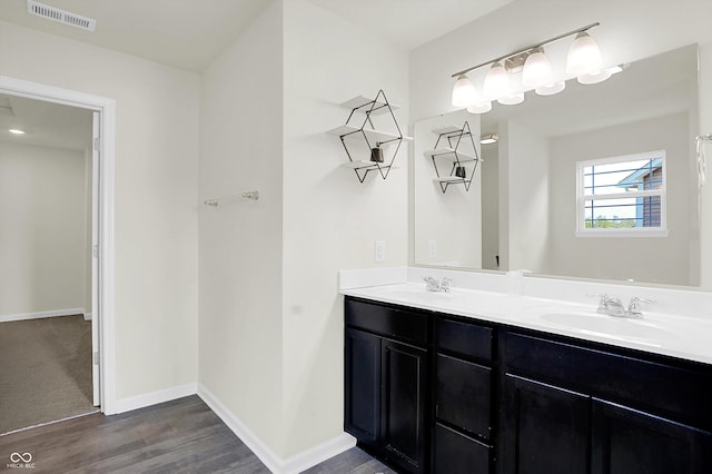 2738 Pointe Club Rd, Indianapolis, IN 46229 - full bathroom featuring wood finished floors and double vanity