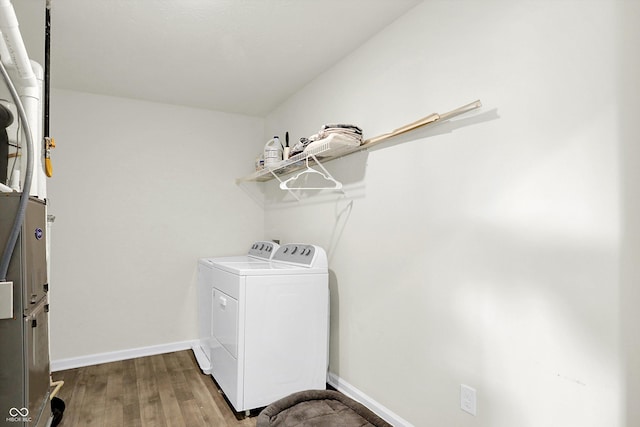 2738 Pointe Club Rd, Indianapolis, IN 46229 - washroom with washer and dryer and wood finished floors