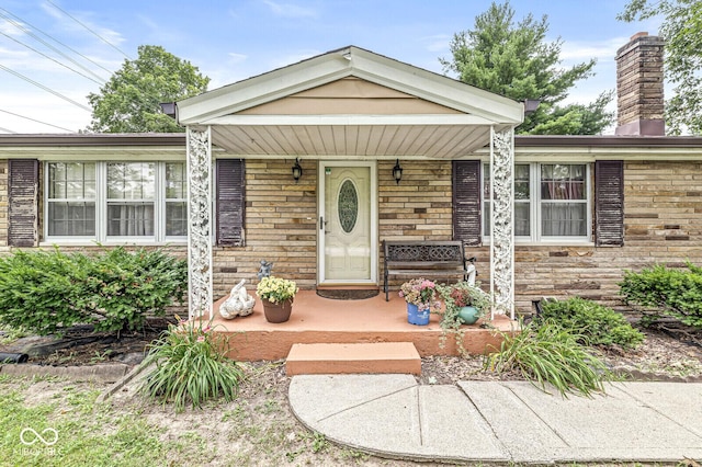 6241 S Meridian St, Indianapolis, IN 46217 - view of front of house featuring covered porch and a chimney