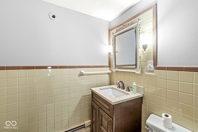 6241 S Meridian St, Indianapolis, IN 46217 - bathroom featuring vanity, tile walls, and wainscoting