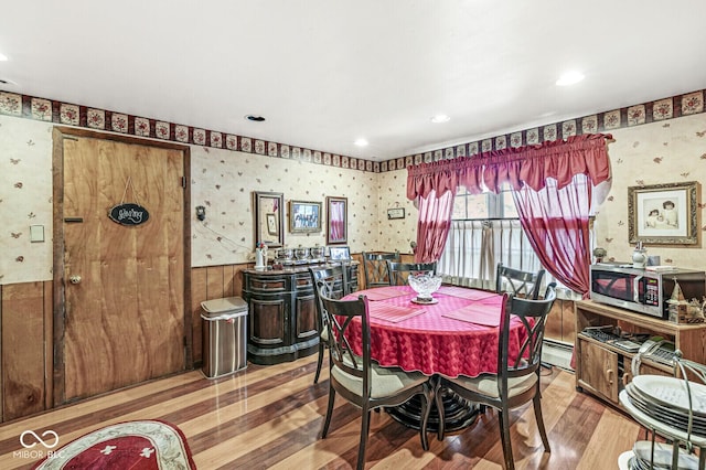 6241 S Meridian St, Indianapolis, IN 46217 - dining area featuring wallpapered walls, wood finished floors, a wainscoted wall, recessed lighting, and a baseboard radiator