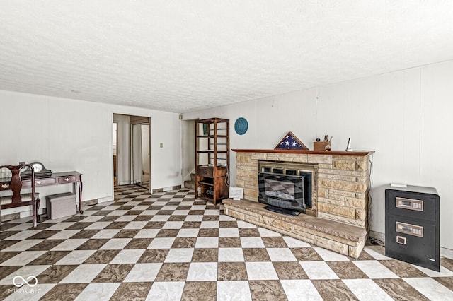 6241 S Meridian St, Indianapolis, IN 46217 - living area featuring a textured ceiling and a fireplace