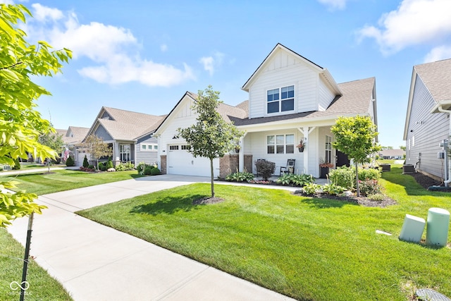 19677 Sumrall Pl, Westfield, IN 46074 - craftsman-style home with concrete driveway, an attached garage, a front yard, and board and batten siding