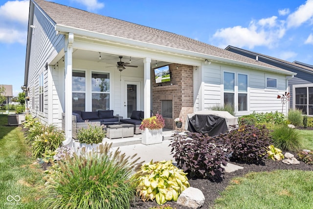 19677 Sumrall Pl, Westfield, IN 46074 - back of property with outdoor lounge area, ceiling fan, a patio area, brick siding, and roof with shingles