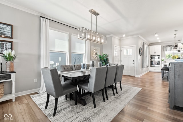 19677 Sumrall Pl, Westfield, IN 46074 - dining space with ornamental molding, healthy amount of natural light, light wood-style floors, recessed lighting, and a chandelier