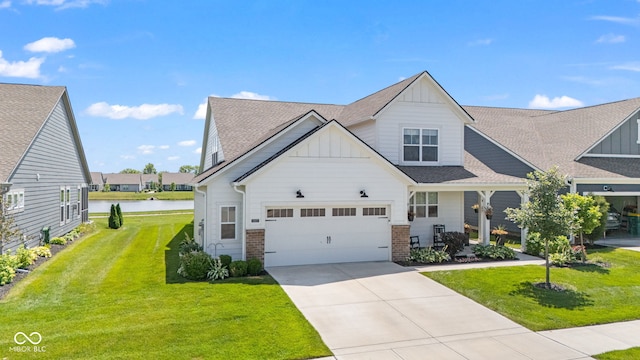 19677 Sumrall Pl, Westfield, IN 46074 - craftsman house featuring board and batten siding, a water view, a front lawn, and brick siding