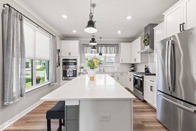 19677 Sumrall Pl, Westfield, IN 46074 - kitchen with appliances with stainless steel finishes, ornamental molding, decorative backsplash, a breakfast bar area, and light countertops