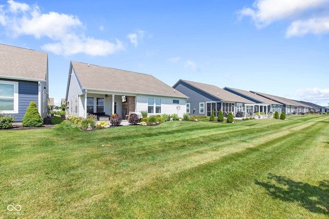19677 Sumrall Pl, Westfield, IN 46074 - back of property featuring ceiling fan, a lawn, a patio, and a residential view