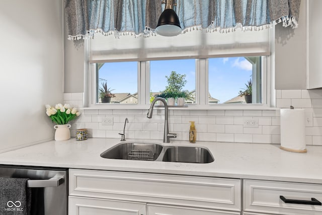 19677 Sumrall Pl, Westfield, IN 46074 - kitchen featuring stainless steel dishwasher, backsplash, and white cabinets