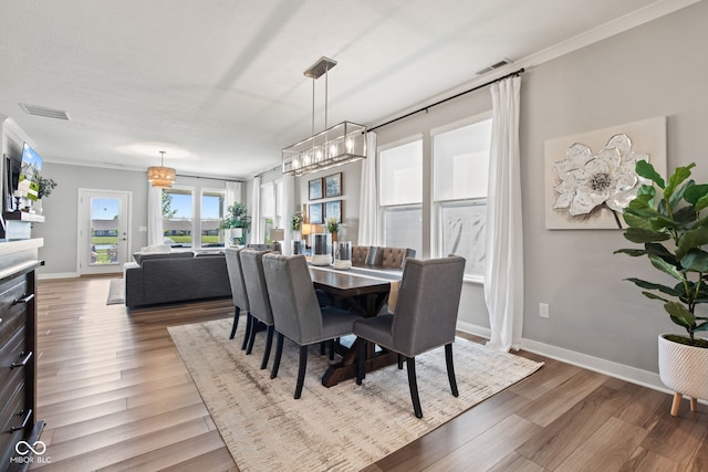 19677 Sumrall Pl, Westfield, IN 46074 - dining room featuring wood finished floors and a chandelier
