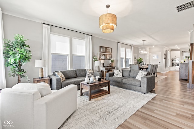 19677 Sumrall Pl, Westfield, IN 46074 - living area featuring crown molding and light wood-type flooring