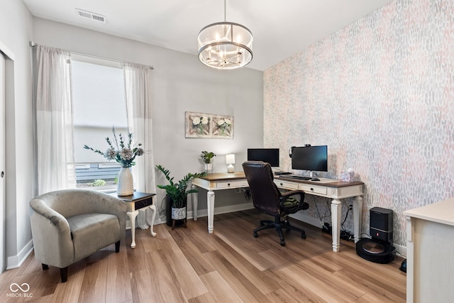 19677 Sumrall Pl, Westfield, IN 46074 - office with wallpapered walls, a chandelier, wood finished floors, and an accent wall