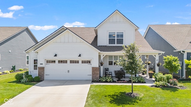 19677 Sumrall Pl, Westfield, IN 46074 - craftsman-style home with board and batten siding, brick siding, a front yard, and an attached garage
