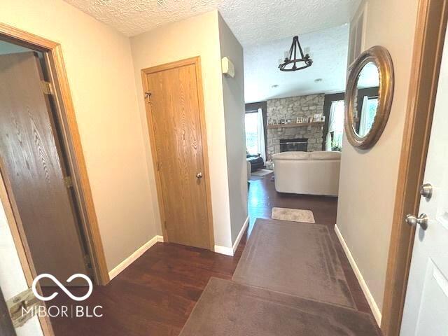 11 Mccutcheon Dr, Lafayette, IN 47909 - hallway with wood finished floors and a textured ceiling