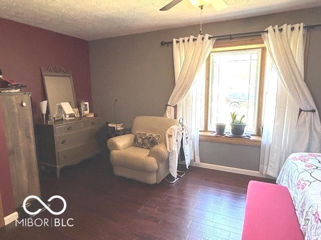 11 Mccutcheon Dr, Lafayette, IN 47909 - bedroom with wood finished floors, a textured ceiling, and a ceiling fan